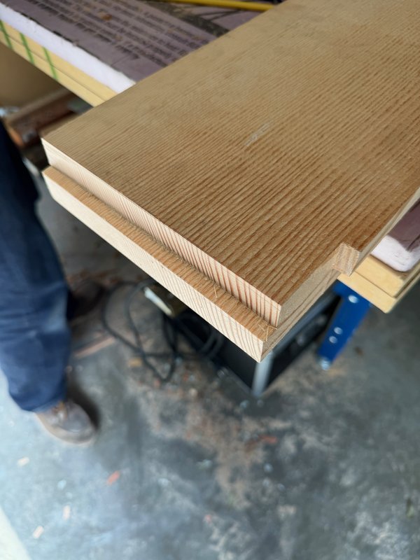 Planing and shaping the new rail.